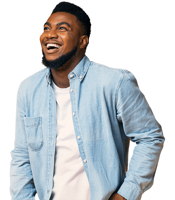 Man laughing wearing denim shirt