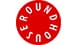 Red circle with white letters spelling "ROUNDHOUSE" along the perimeter inside the circle.