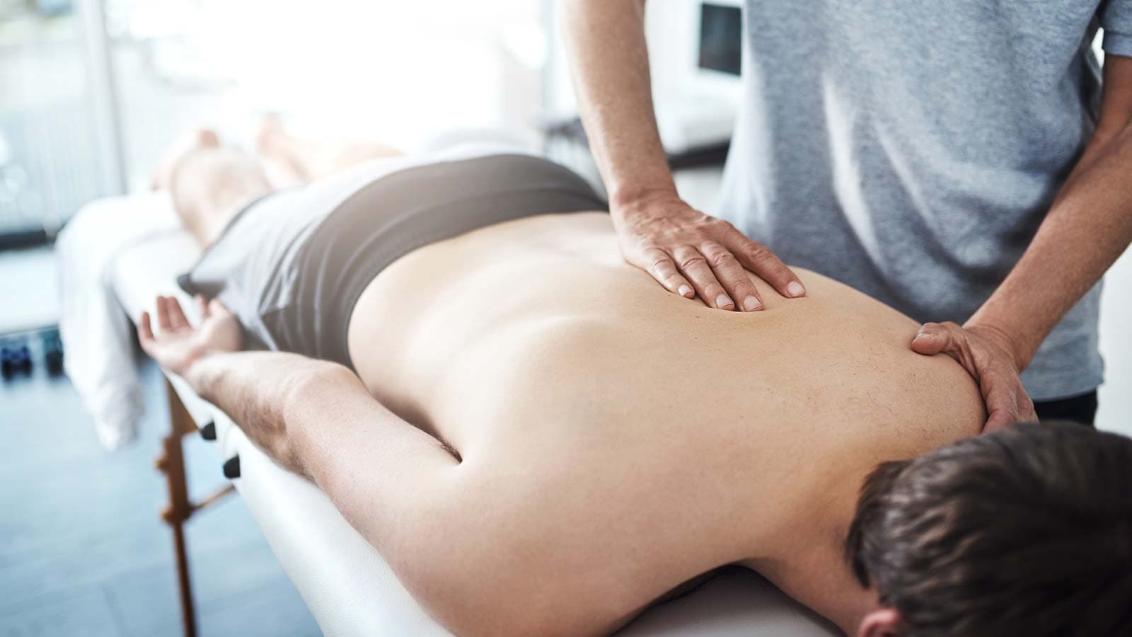 Patient lying face down during chiropractic treatment