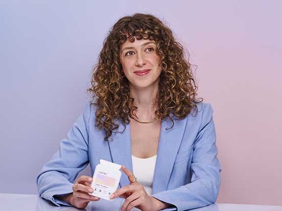 Woman holding Unfabled sustainable product