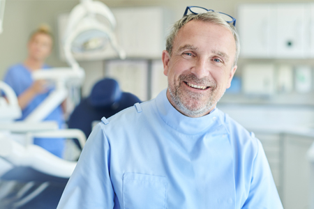 Dentist smiling in clinic