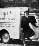 Black and white photograph of nurse standing alongside a mobile health service van depicting 70 years of the NHS