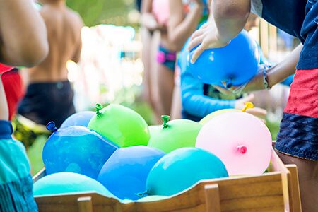 Water balloons in a wooden crate