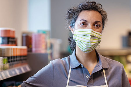 Shop worker wearing face mask
