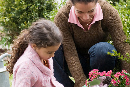 Mum and daughter gardening to build resilience