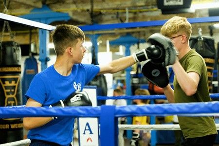 Two amateur boxers in the ring at Rawthorpe Amateur Boxing Club