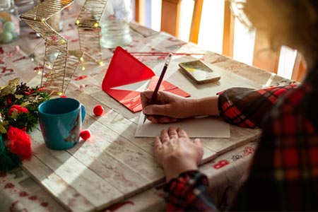 Woman writing letter and christmas time