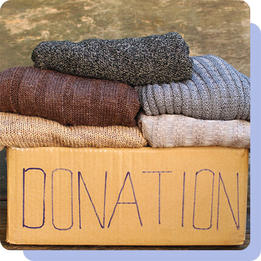A donation box of winter jumpers