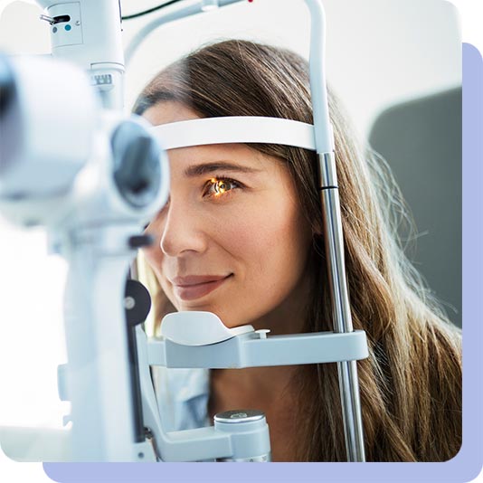 A woman having an eye examination at opticians