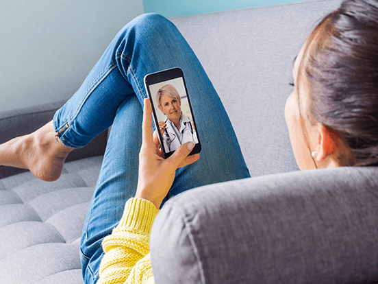 Woman having a video call with GP