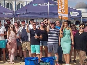 Simplyhealth employees volunteering on a beach clean