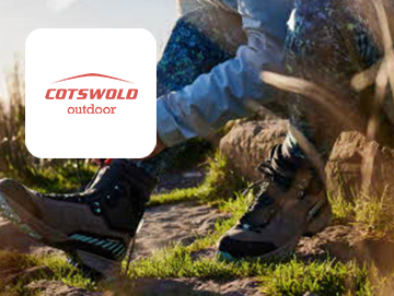 Cotswold Outdoor logo on image of woman lacing up hiking boots