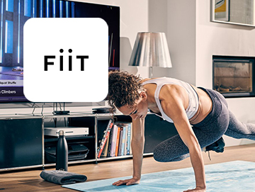 Fiit logo on image of woman working out at home