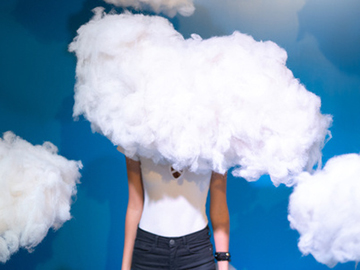 Woman with her face covered by a cloud