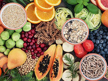 A selection of fibre-rich fruits, vegetables and grains